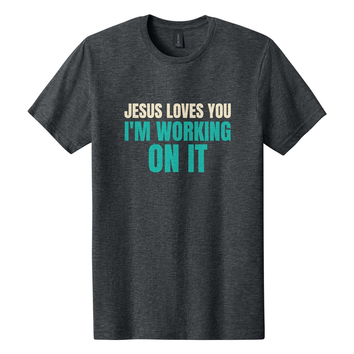 Jesus Loves You. I'm Working on It tee in Dark Heather, Anton font, Cream + Teal ink