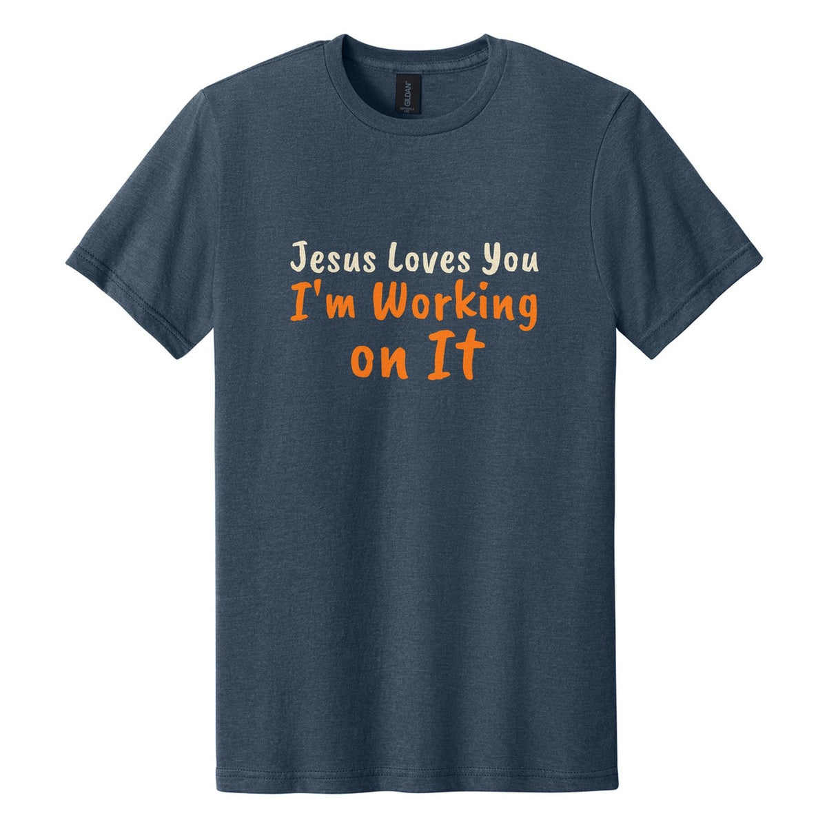 Jesus Loves You. I'm Working on It tee in Navy Mist, Caveat Brush font, Cream + Orange ink