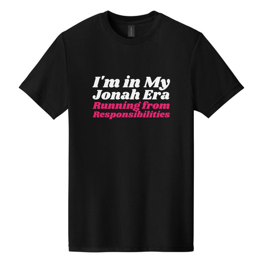 I'm in My Jonah Era. Running from Responsibilities tee in Pitch Black, Shrikhand font, White + Hot Pink ink