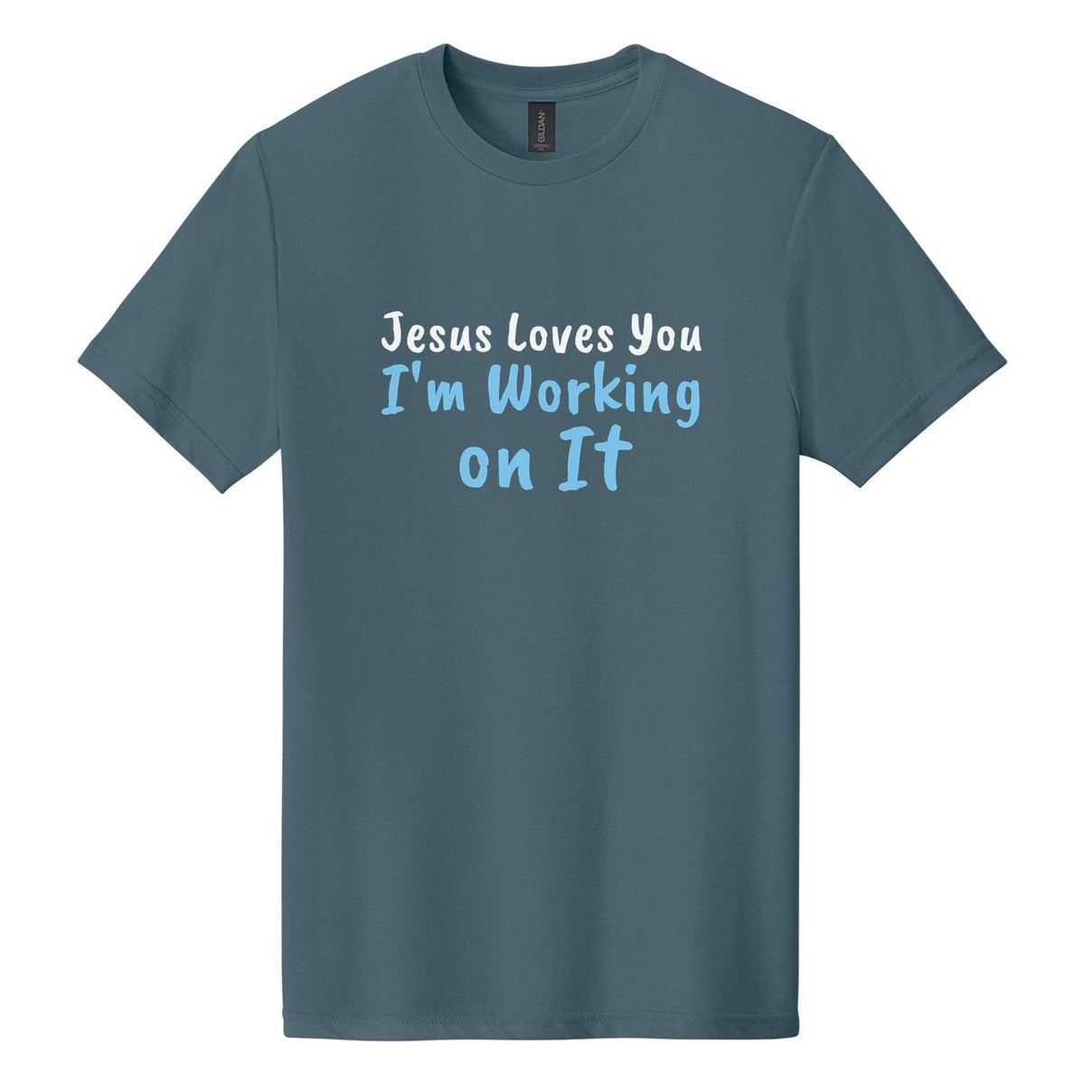 Jesus Loves You. I'm Working on It tee in Steel Blue, Caveat Brush font, White + Sky Blue ink