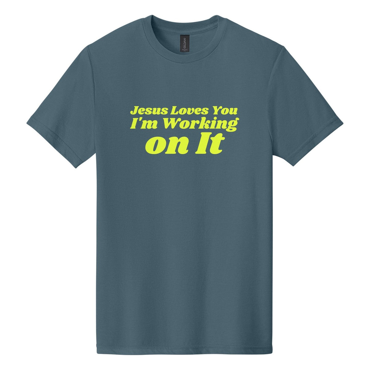 Jesus Loves You. I'm Working on It tee in Steel Blue, Shrikhand font, Neon Yellow ink