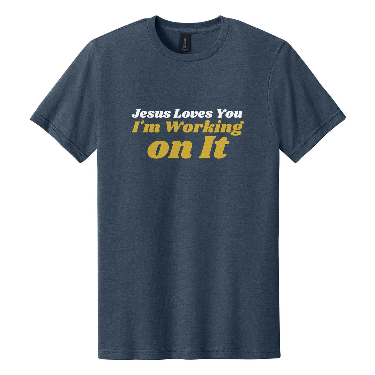 Jesus Loves You. I'm Working on It tee in Navy Mist, Shrikhand font, White + Metallic Gold ink