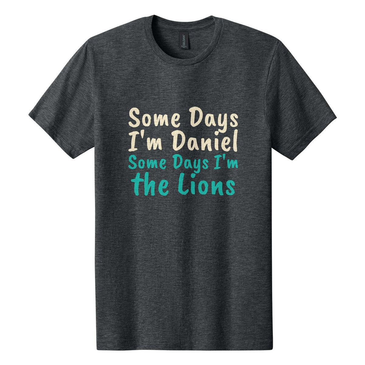 Some Days I'm Daniel. Some Days I'm the Lions tee in Dark Heather, Caveat Brush font, Cream + Teal ink