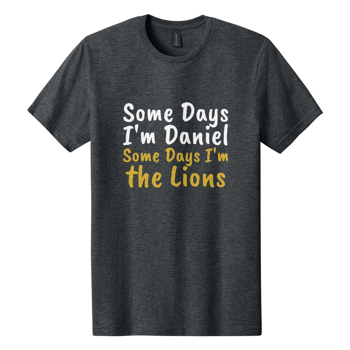 Some Days I'm Daniel. Some Days I'm the Lions tee in Dark Heather, Caveat Brush font, White + Metallic Gold ink