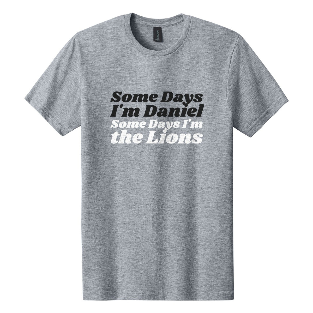Some Days I'm Daniel. Some Days I'm the Lions tee in Ring Spun Sport Grey, Shrikhand font, Black + White ink