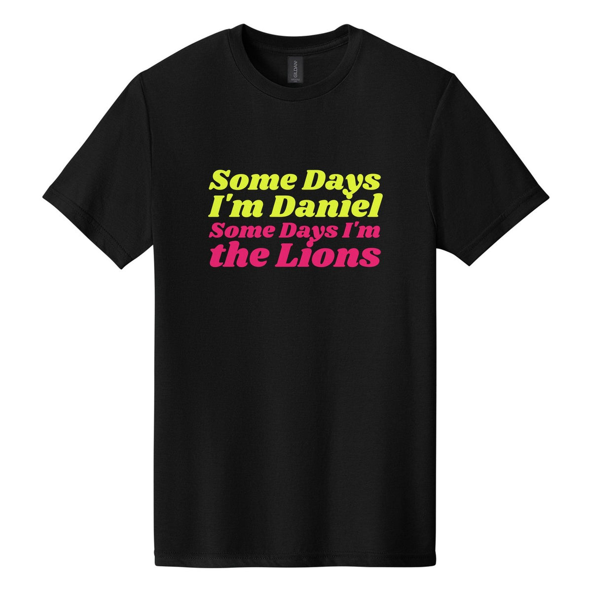 Some Days I'm Daniel. Some Days I'm the Lions tee in Pitch Black, Shrikhand font, Neon Yellow + Hot Pink ink
