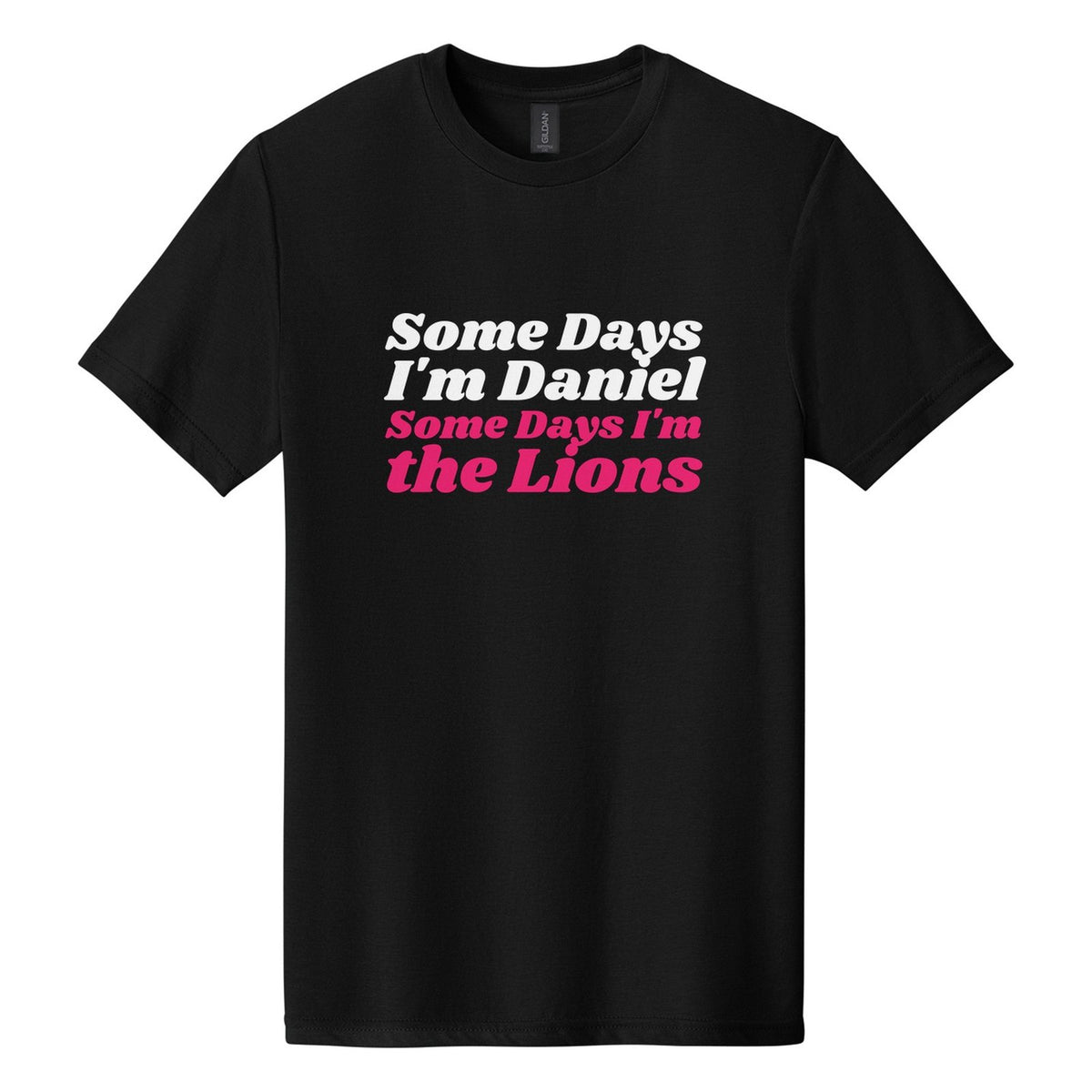 Some Days I'm Daniel. Some Days I'm the Lions tee in Pitch Black, Shrikhand font, White + Hot Pink ink