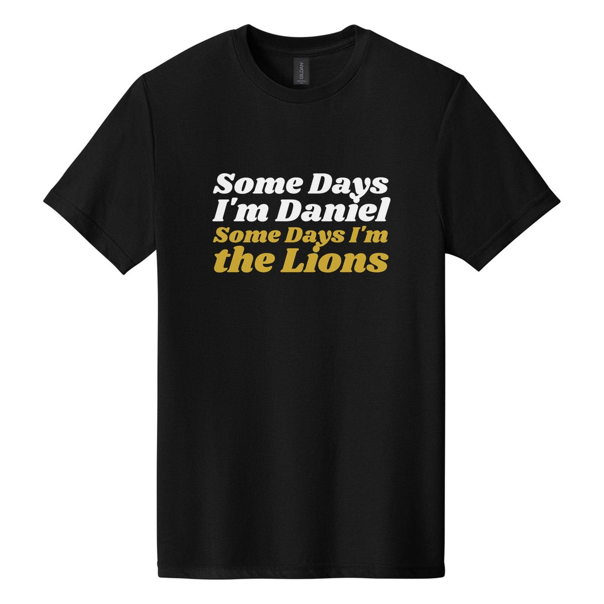 Some Days I'm Daniel. Some Days I'm the Lions tee in Pitch Black, Shrikhand font, White + Metallic Gold ink