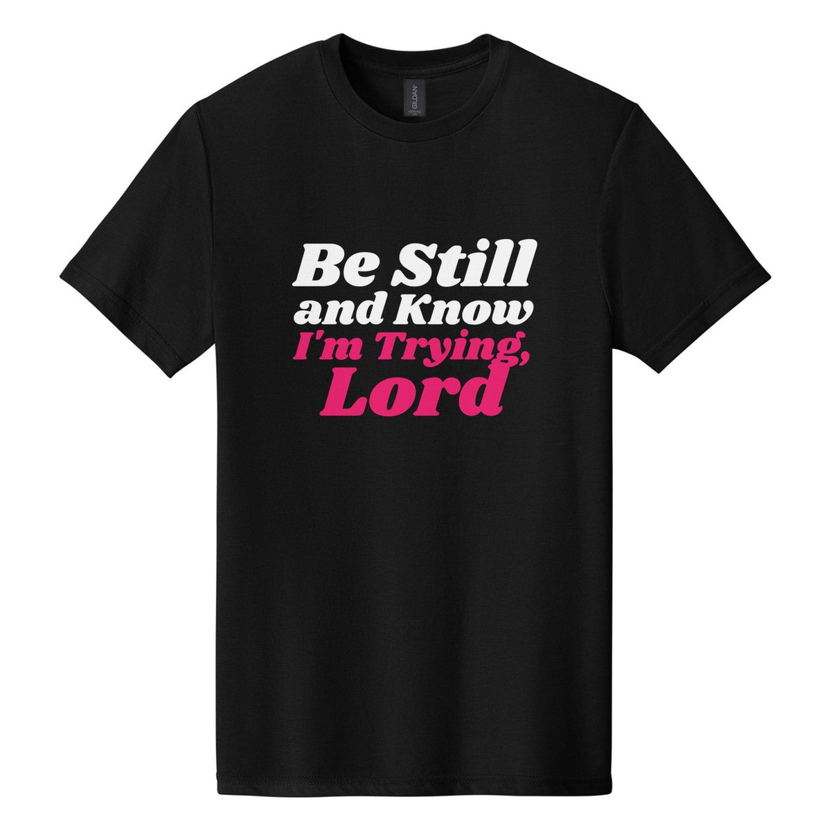 Be Still and Know. I'm Trying, Lord tee in Pitch Black, Shrikhand font, White + Hot Pink ink