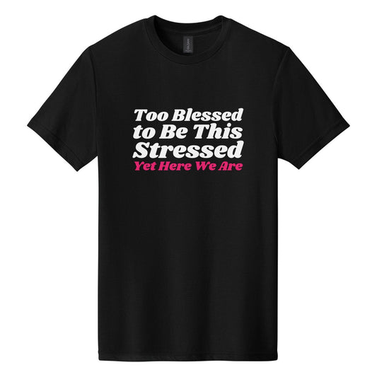 Too Blessed to Be This Stressed. Yet Here We Are tee in Pitch Black, Shrikhand font, White + Hot Pink ink