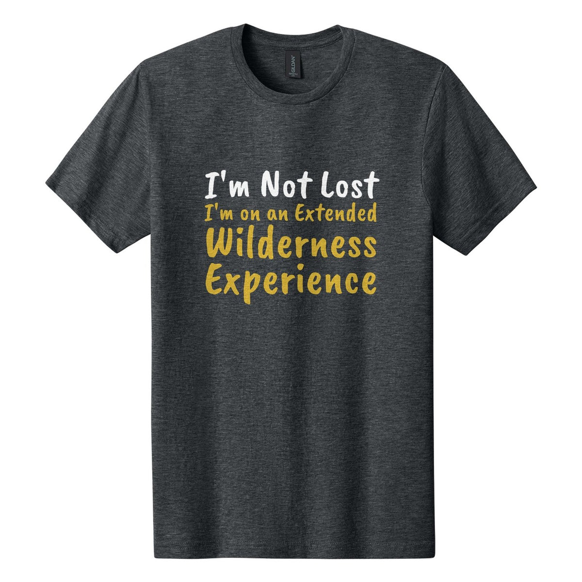 I'm Not Lost. I'm on an Extended Wilderness Experience tee in Dark Heather, Caveat Brush font, White + Metallic Gold ink