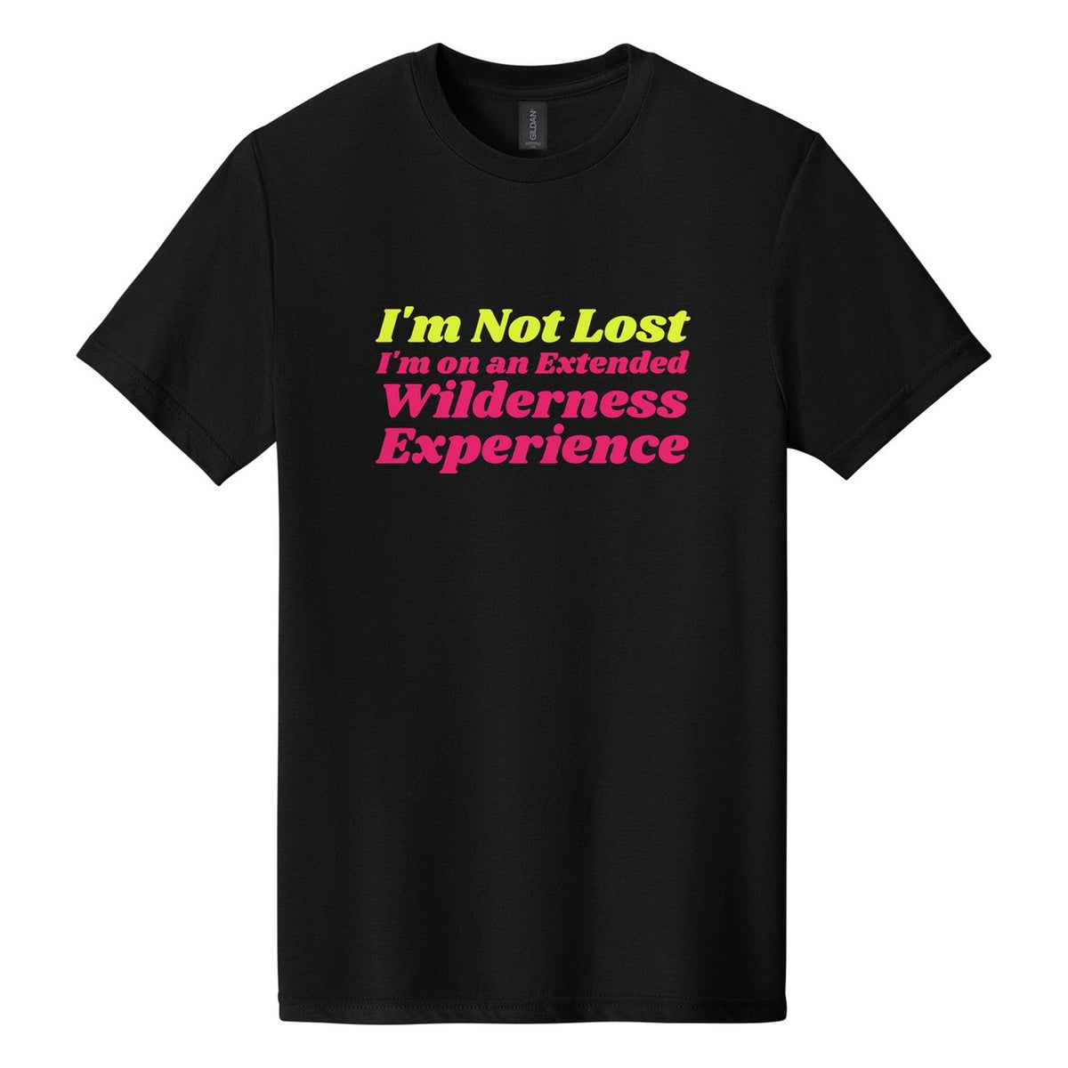 I'm Not Lost. I'm on an Extended Wilderness Experience tee in Pitch Black, Shrikhand font, Neon Yellow + Hot Pink ink