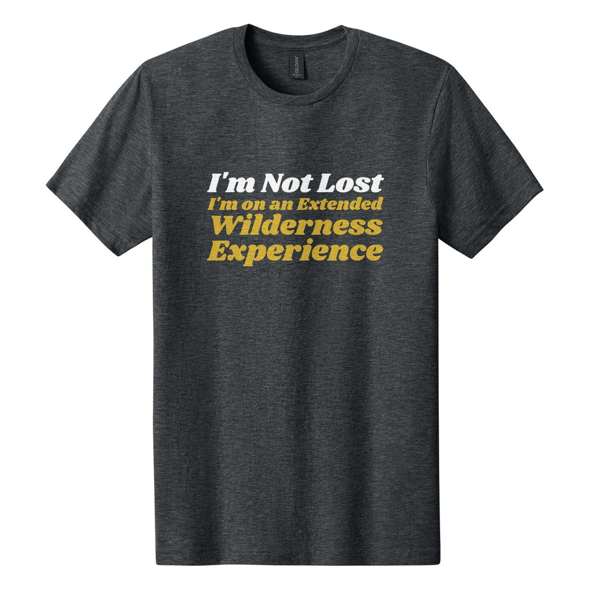 I'm Not Lost. I'm on an Extended Wilderness Experience tee in Dark Heather, Shrikhand font, White + Metallic Gold ink